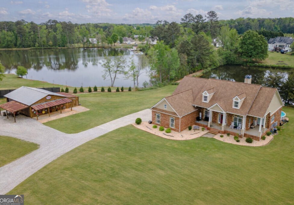 HD_1775675717307_Quiet_pondside_home_in_daylight